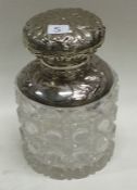 A good cut glass and silver mounted scent bottle with floral decoration.