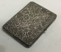 A fine quality silver card case with chased decoration.