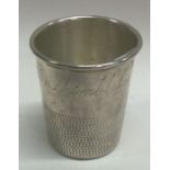 An American silver shot cup inscribed, 'Just a Thimbleful'.