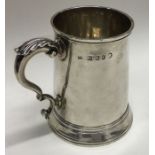 HESTER BATEMAN: A good Georgian silver tapering mug with scroll handle and crested front. London.