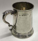 HESTER BATEMAN: A good Georgian silver tapering mug with scroll handle and crested front. London.