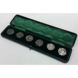 A boxed set of stylish silver buttons.