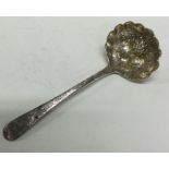 A good Georgian silver ladle with embossed decoration.