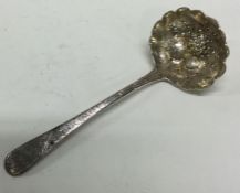 A good Georgian silver ladle with embossed decoration.
