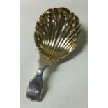 A fluted Georgian silver caddy spoon. London 1828. By Edward Edwards.