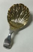 A fluted Georgian silver caddy spoon. London 1828. By Edward Edwards.