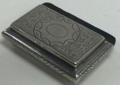 A Victorian silver chased hinged snuff box. London 1898.