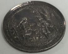 An early 17th Century silver coin.