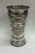A large 18th Century Russian silver chalice embossed with animals and mythical creatures.
