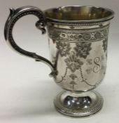 EXETER: An attractive engraved silver christening mug by JW&JW.