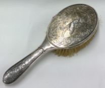 A Victorian chased silver brush embossed with birds. Birmingham 1900. By Elkington & Co.