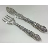 A pair of large Victorian Aesthetic Movement silver servers. Birmingham 1850. By George Unite.