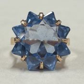 An unusual blue stone ring in 9 carat claw mount.