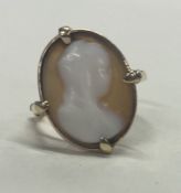 A 9 carat cameo ring in claw mount.