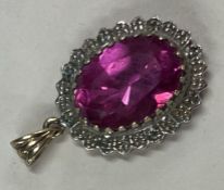 A small 9 carat gem set pendant.