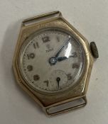 TUDOR: A ladies gold wrist watch with silvered dial.