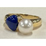 An 18 carat gold pearl and lapis cocktail ring.