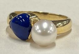 An 18 carat gold pearl and lapis cocktail ring.