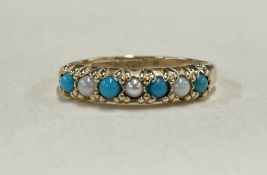 A turquoise and pearl half eternity ring in 9 carat setting.