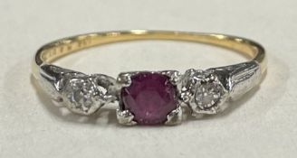 A small Antique ruby and diamond three stone ring in 18 carat mount.