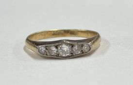 A small diamond five stone ring in 18 carat gold setting.