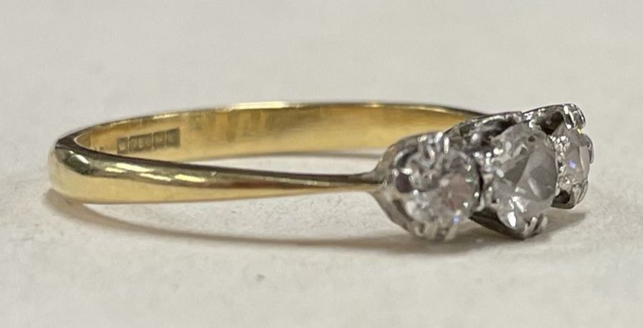 A small diamond three stone ring in 18 carat gold and platinum setting. - Image 2 of 2