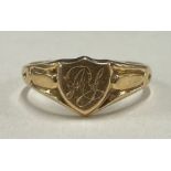 A small 18 carat gold signet ring of shield form.