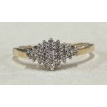 A diamond cluster ring in 9 carat claw mount.