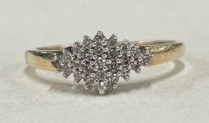 A diamond cluster ring in 9 carat claw mount.