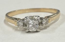 A small diamond single stone ring in 18 carat gold claw mount.