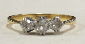 A small diamond three stone ring in 18 carat gold and platinum setting.