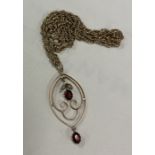 A large garnet mounted pendant on 9 carat rope twist chain.