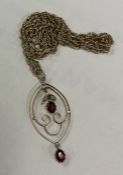 A large garnet mounted pendant on 9 carat rope twist chain.