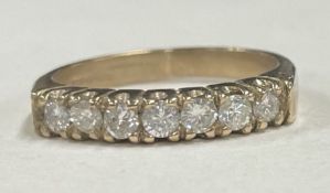A good diamond half eternity ring in 9 carat claw mount.