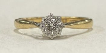 A small diamond single stone ring in 18 carat gold mount.