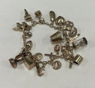 A heavy 9 carat charm bracelet with ring clasp.