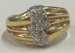 An unusual diamond mounted cocktail ring in 18 carat gold setting.