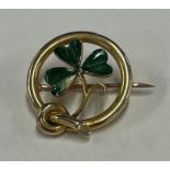 An attractive 15 carat gold clover brooch.