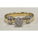 A small diamond single stone ring in 18 carat gold claw mount.