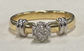 A small diamond single stone ring in 18 carat gold claw mount.