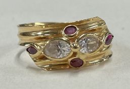 An unusual ruby mounted cocktail ring in high carat mount.