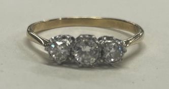 A good diamond three stone ring in 18 carat gold and platinum setting.