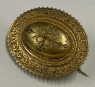 A good Victorian 15 carat gold target brooch with locket back.