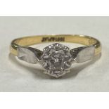 An 18 carat gold and diamond single stone ring in claw mount.