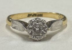 An 18 carat gold and diamond single stone ring in claw mount.