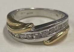 A heavy 18 carat gold and diamond mounted single row ring of twist form.