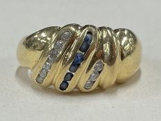 A heavy 18 carat gold sapphire and diamond cocktail ring.