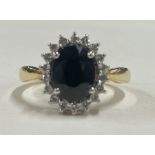 A good circular sapphire and diamond cluster ring in 18 carat gold claw mount.