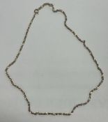 A ladies small 14 carat gold necklace with ring clasp.
