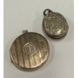 A small gold locket together with a gilt example.